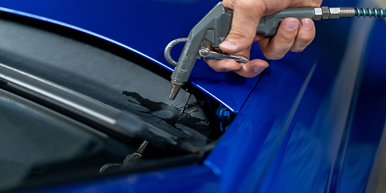 High-powered air blower used in South Florida's car air dry service for a streak-free, touch-free drying experience.