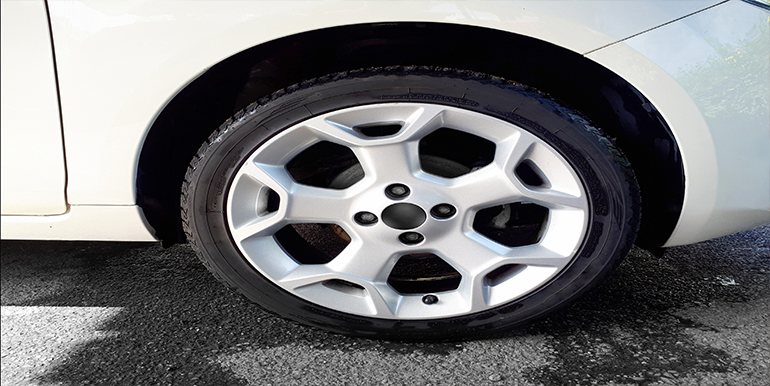 Professional iron removal service by Broward Detailers in South Florida, effectively eliminating iron particles from car wheels to enhance their appearance and protect against damage.