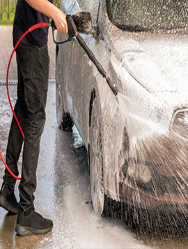 Professional mobile car wash service in South Florida, featuring high-pressure foam application for effective cleaning of a vehicle's exterior.