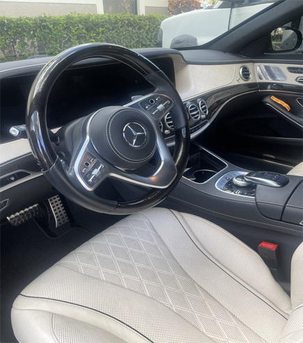 Luxurious interior of a Mercedes-Benz showcasing the premium car detailing services provided by Broward Detailers.